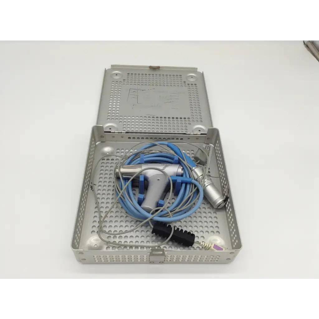 Silver perforated metal surgical tray with blue and gray gyrus acmi diego shaver handpiece and attached cables