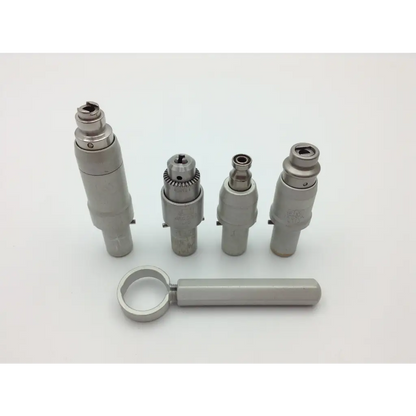 Set of four metallic dental handpieces with varying tips and matching handle in polished silver with a maxi-driver ii autoclave case
