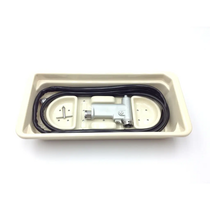 Silver dental handpiece with black coiled cord in beige tray for hall 3m maxi driver ii autoclave case power set