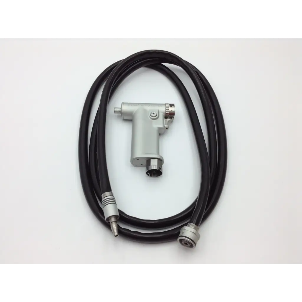 Silver handheld dental handpiece with black tubing and metallic connectors in hall 3m maxi driver ii autoclave case