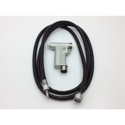 Silver handheld dental handpiece with black tubing and metallic connectors in hall 3m maxi driver ii autoclave case