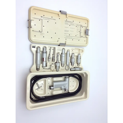 Hall 3m maxi driver air surgical power set with silver metallic tools and black hose in maxi-driver ii autoclave case
