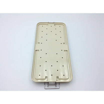 Beige plastic surgical instrument tray with metal handle and circular indentations in maxi-driver ii autoclave case