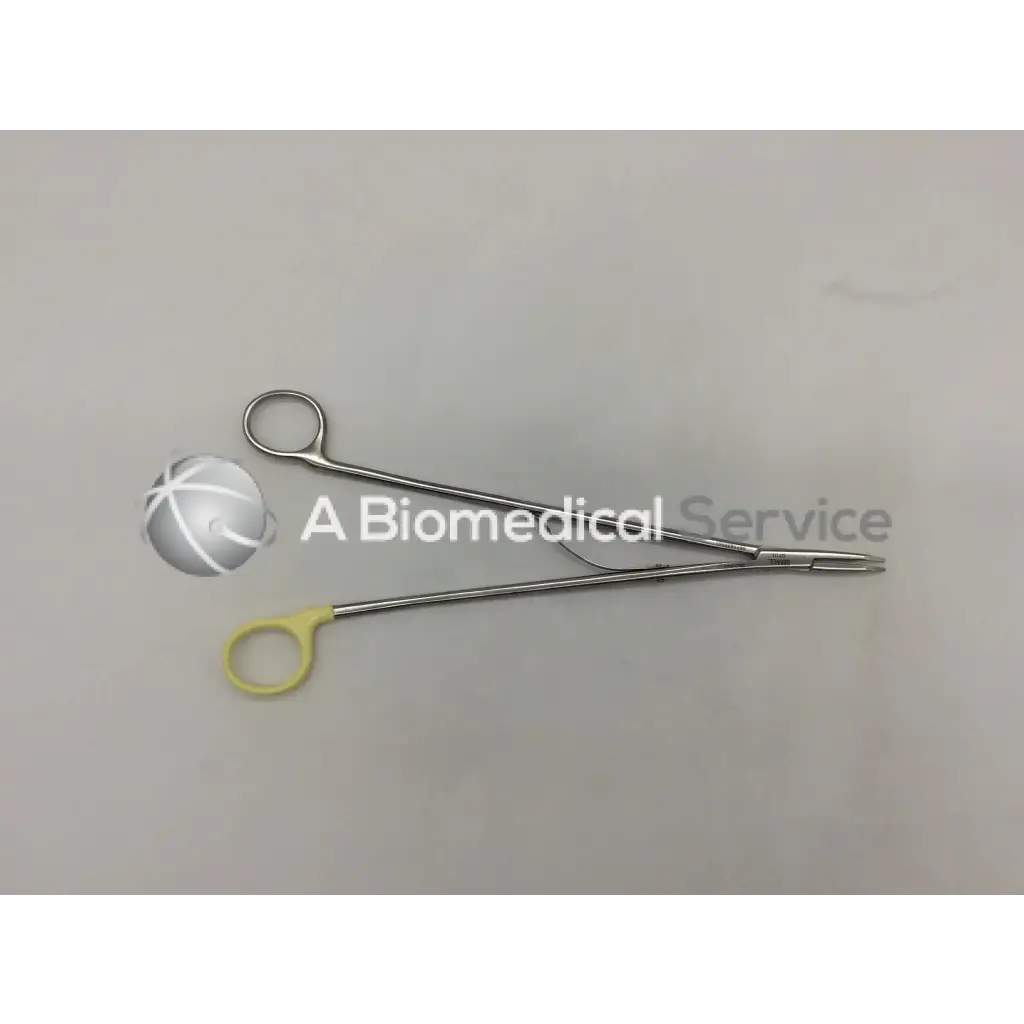 Silver surgical open ligating clip appliers small with yellow handle and fine pointed tips for precise clipping
