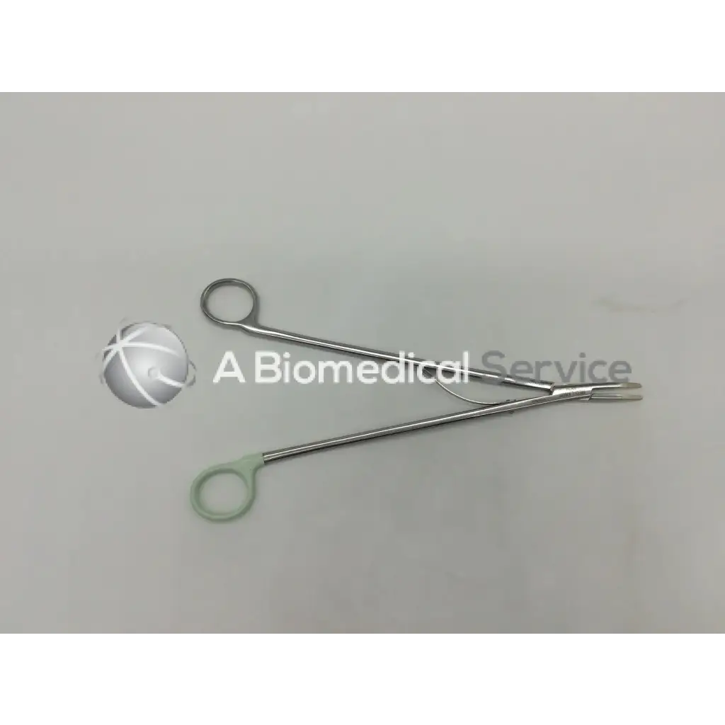 Silver surgical open ligating clip appliers medium curved with one light green ergonomic handle grip