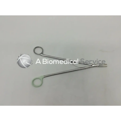 Silver surgical open ligating clip appliers medium curved with one light green ergonomic handle grip