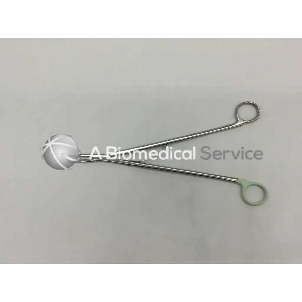 Silver open ligating clip appliers medium large curved with white spherical tips and green rubberized handles