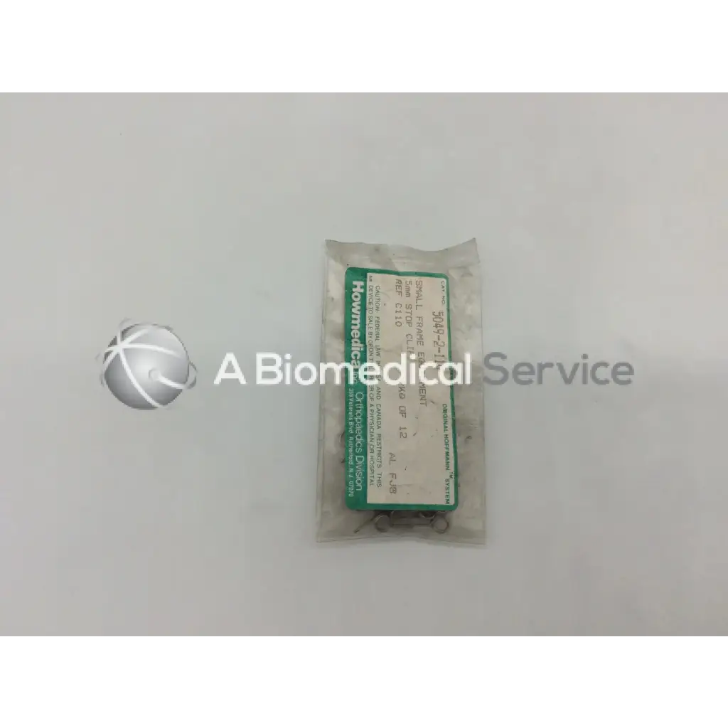 A package of small metallic orthopedic fixation stop clips 5mm from Howmedica with green and white label