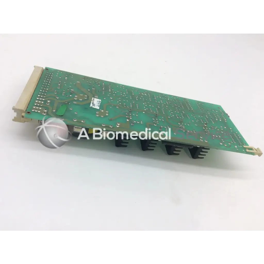 Green rectangular instem 2065555g rev j hmk9048 board with silver solder points black heat sinks and beige connectors