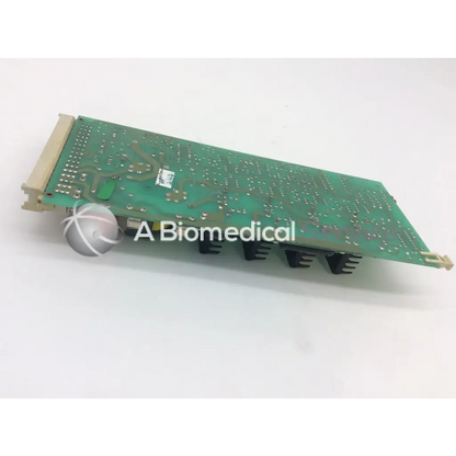 Green rectangular instem 2065555g rev j hmk9048 board with silver solder points black heat sinks and beige connectors