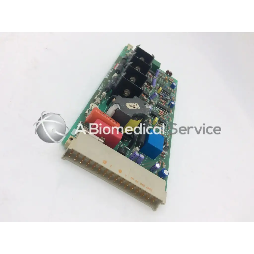 Green circuit board with black red blue and purple electronic components instem 2065555g rev j hmk9048 board