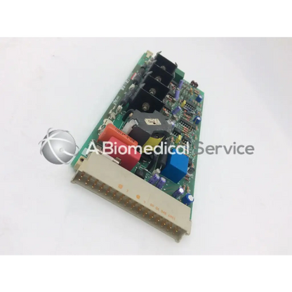 Green circuit board with black red blue and purple electronic components instem 2065555g rev j hmk9048 board