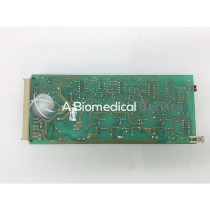 Green rectangular instem 2065555g rev j hmk9048 board with silver soldered components and white circular connector on left side
