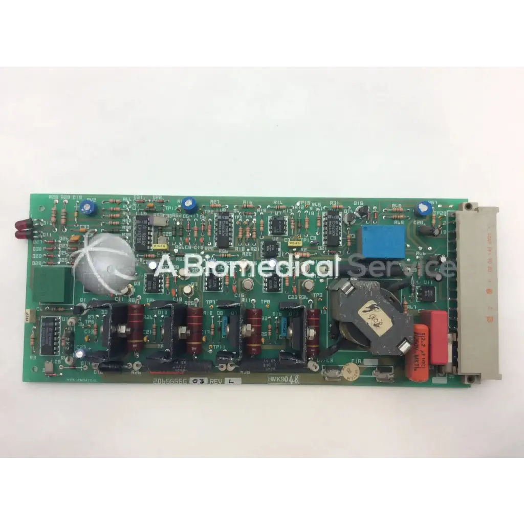 Green rectangular printed circuit board with capacitors resistors and integrated circuits instem 2065555g rev l hmk9048 board