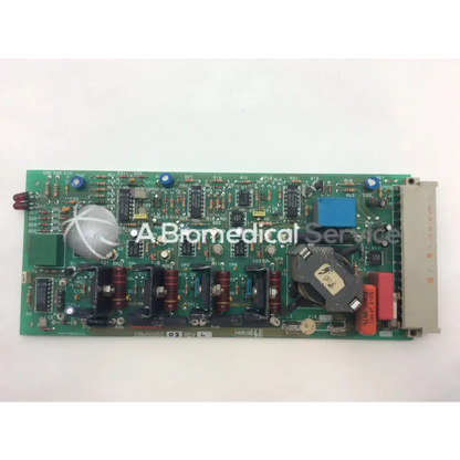 Green rectangular printed circuit board with capacitors resistors and integrated circuits instem 2065555g rev l hmk9048 board