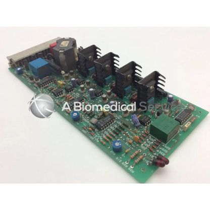 Green printed circuit board with black heat sinks blue capacitors and components instem 2065555g rev l hmk9048 board