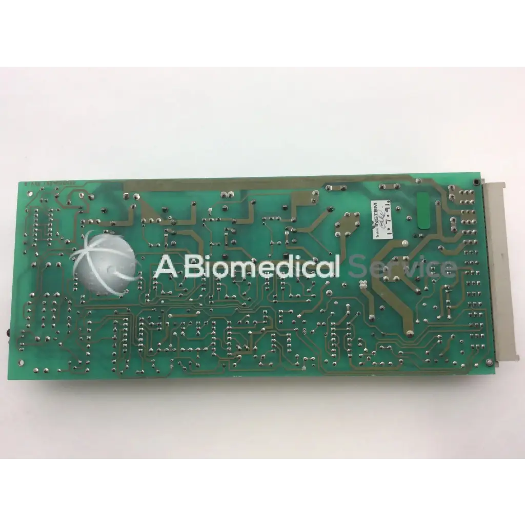 Green rectangular instem 2065555g rev l hmk9048 board with silver solder points and white logo on circuit board