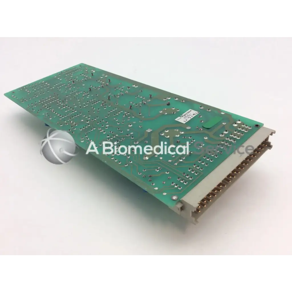Green printed circuit board with silver soldered components and beige connector edge instem 2065555g rev l hmk9048 board