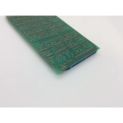 Green rectangular instem 442 2d65779g01 rev circuit board with silver solder points and blue connector pins