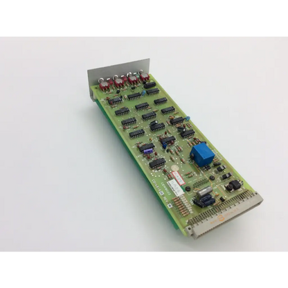 Green printed circuit board with black integrated circuits red capacitors and blue component instem c21401811 rev c cew9023 c214020 rev d