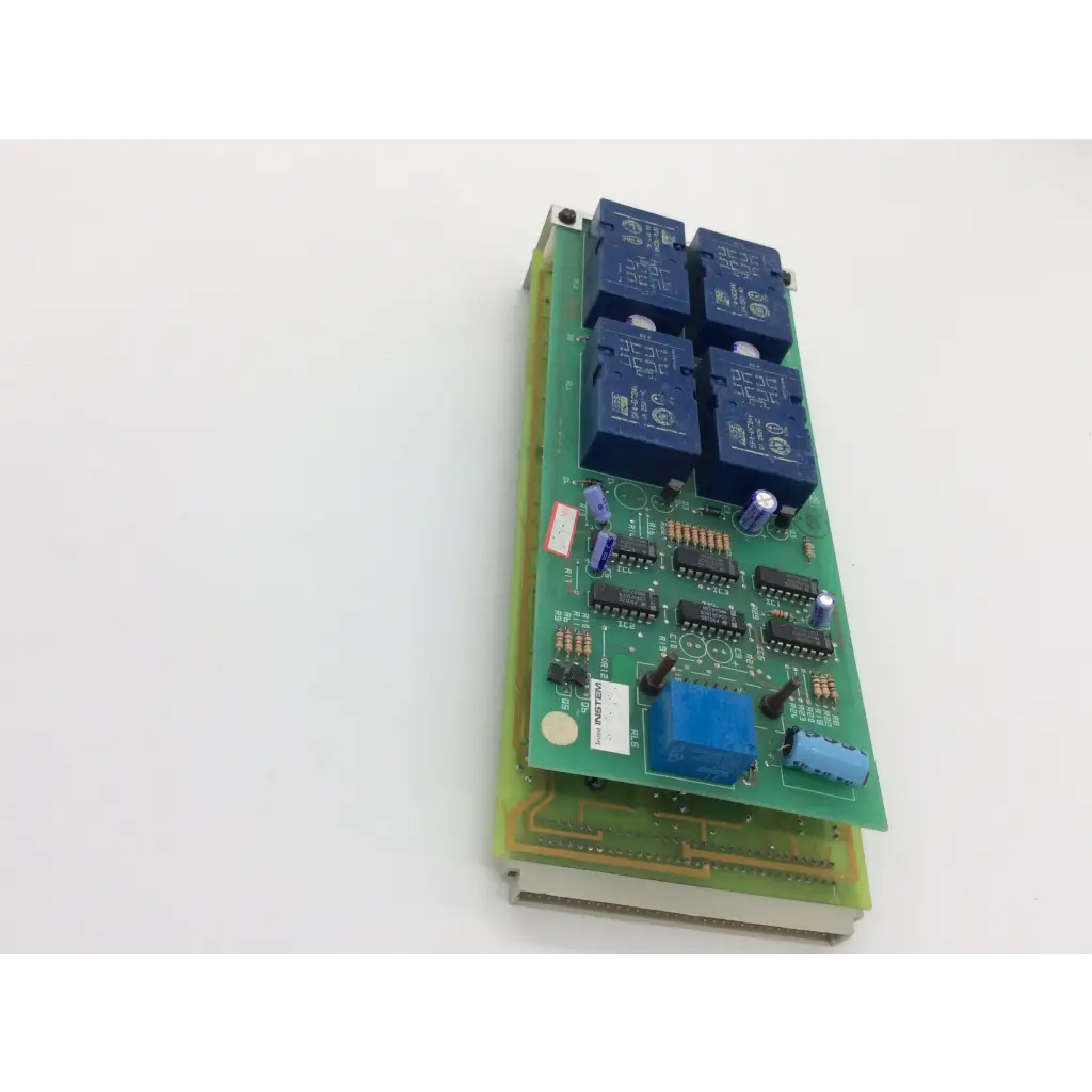 Green printed circuit board with four blue relay modules featuring instem c21401811 rev and rev c cew9023 components