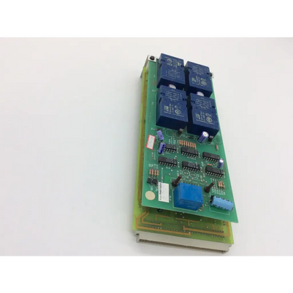 Green printed circuit board with four blue relay modules featuring instem c21401811 rev and rev c cew9023 components