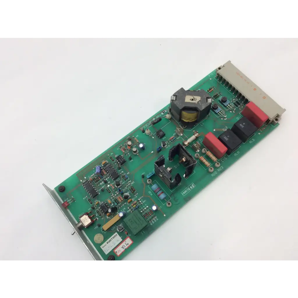 Green printed circuit board instem hmk9105 rev b control with red and black capacitors and 7222c65001 rev integrated circuits