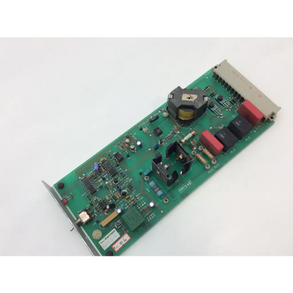 Green printed circuit board instem hmk9105 rev b control with red and black capacitors and 7222c65001 rev integrated circuits