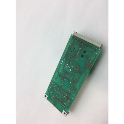 Green rectangular instem hmk9105 rev b control circuit board with silver edges and soldered components 7222c65001 rev