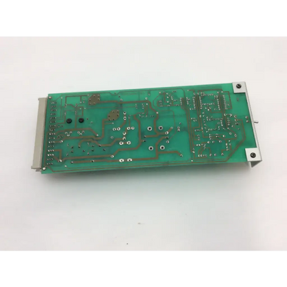 Green printed circuit board with silver soldered components and metallic edge connectors for instem hmk9105 rev b control board 7222c65001 rev