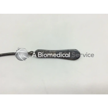 Integra jarit black metal uterine sound ac5-276 with rounded handle attached to black cord for medical use