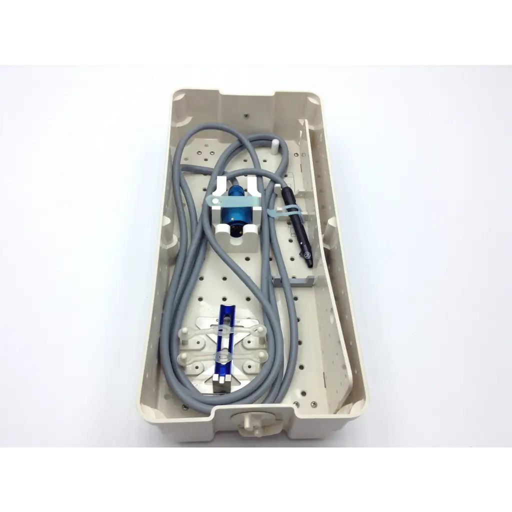 Beige plastic sterilization case tray with neatly arranged gray cables and cusa excel ultrasonic aspirator 36khz instruments