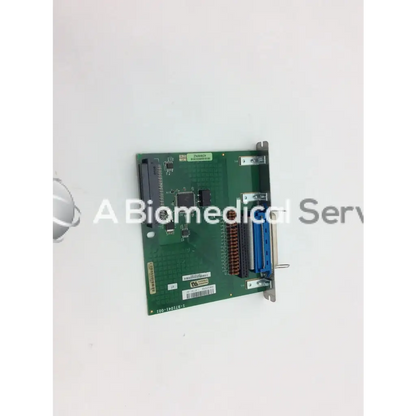 Green rectangular intermec parallel port i o board with blue brown connectors and metallic mounting bracket bbcf1-5