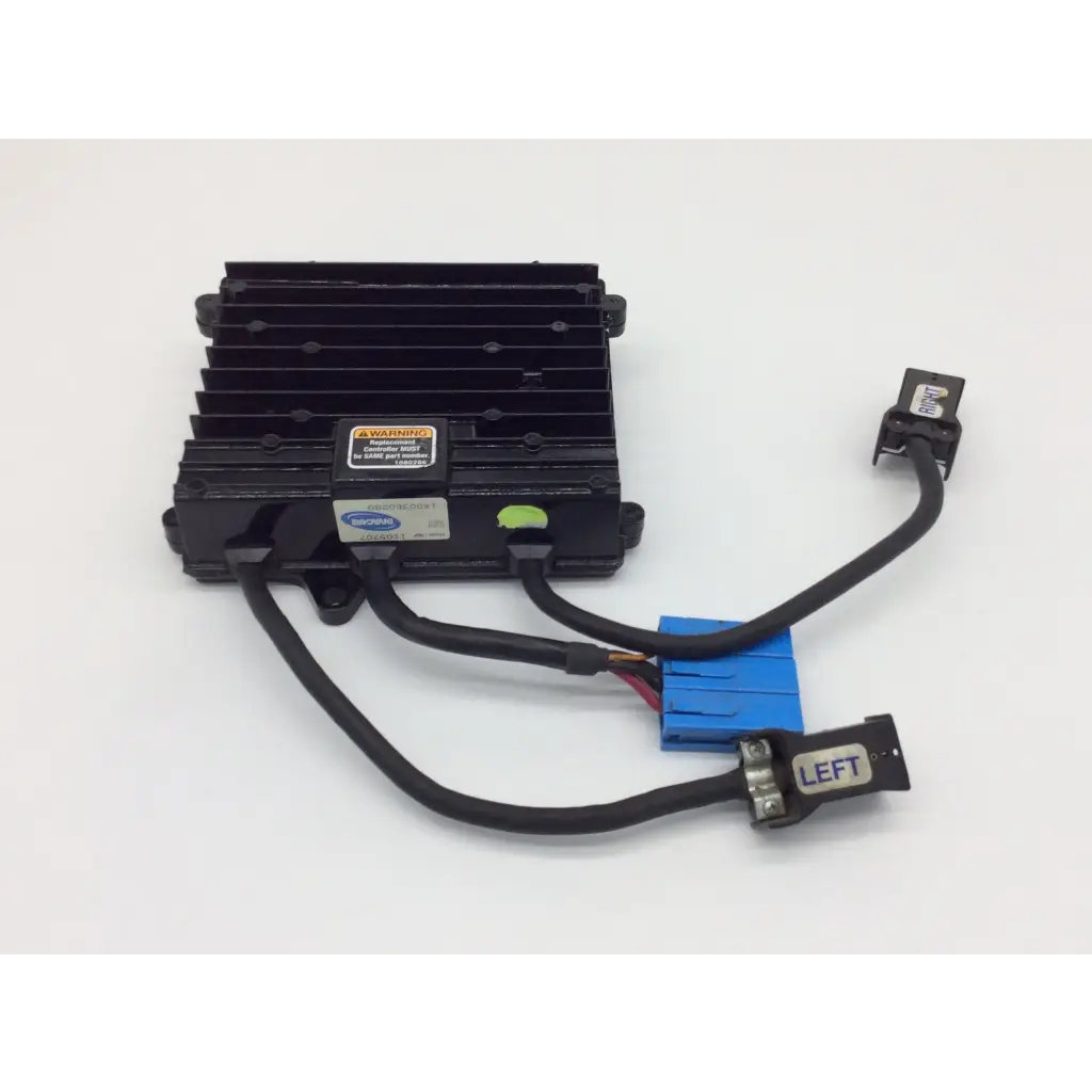 Black plastic control module with heat sinks and blue connector labeled left for invacare power wheelchair