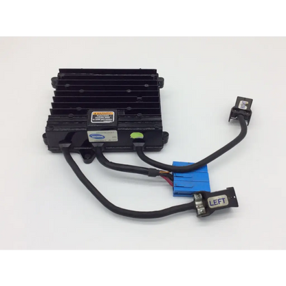 Black plastic control module with heat sinks and blue connector labeled left for invacare power wheelchair