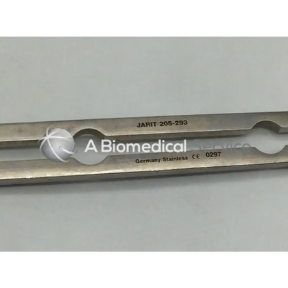 Silver stainless steel balfour center blade surgical instrument with engraved markings and two circular cutouts