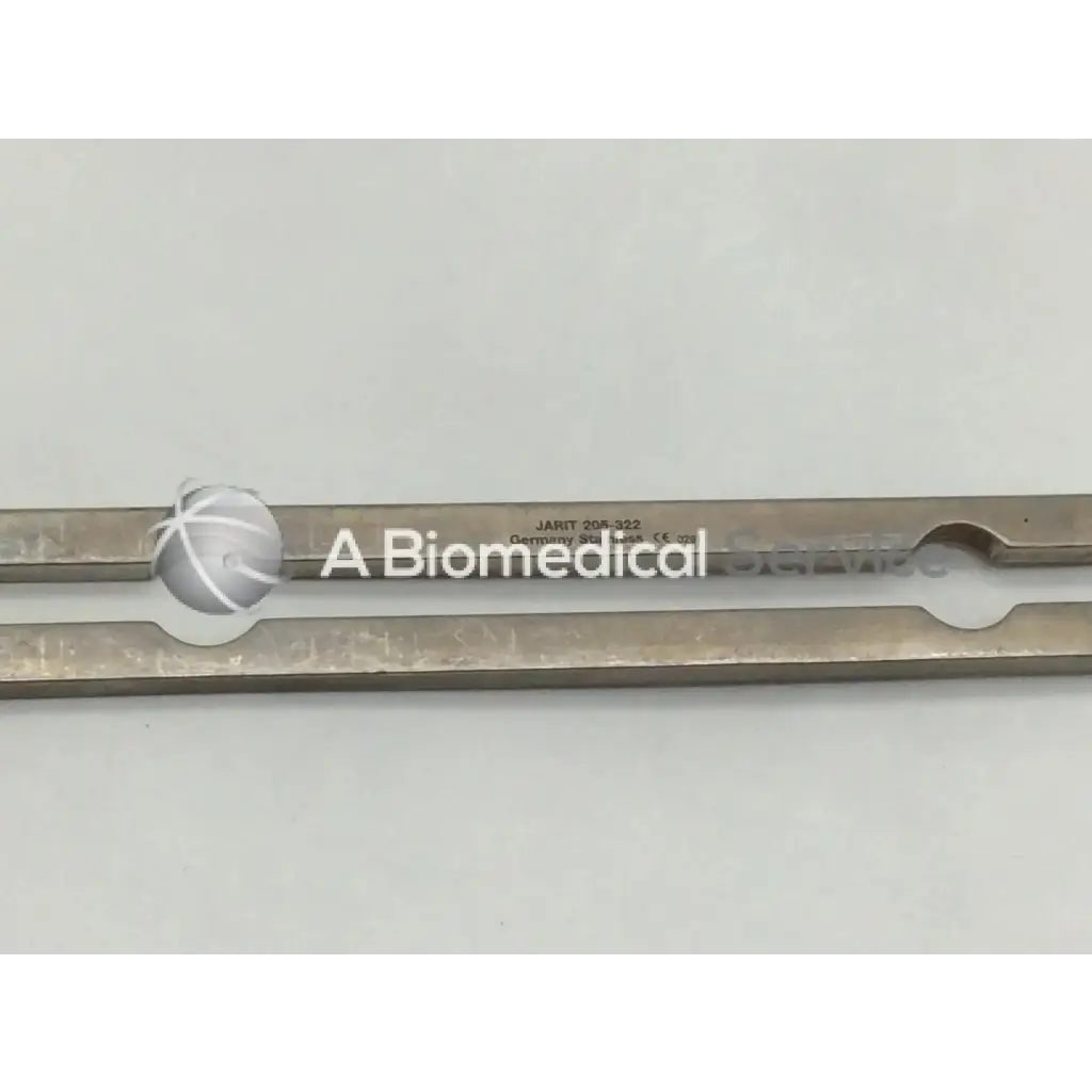Silver-colored metal jarit 205-322 balfour center blade with elongated design and circular cutouts for surgical use