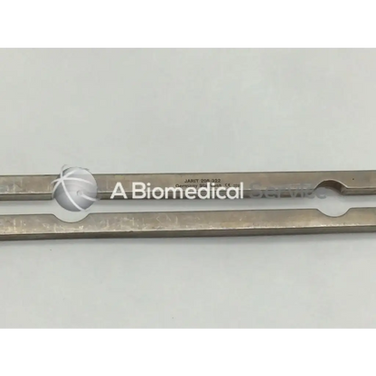Silver-colored metal jarit 205-322 balfour center blade with elongated design and circular cutouts for surgical use