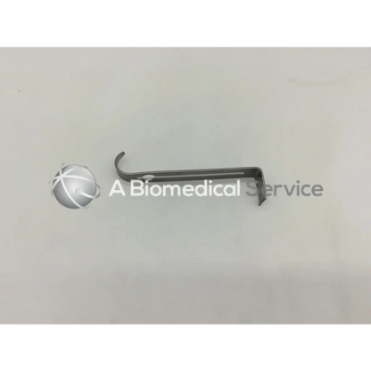 Silver metallic jarit 205-542 center retractor blade with curved handle and straight blade for surgical use