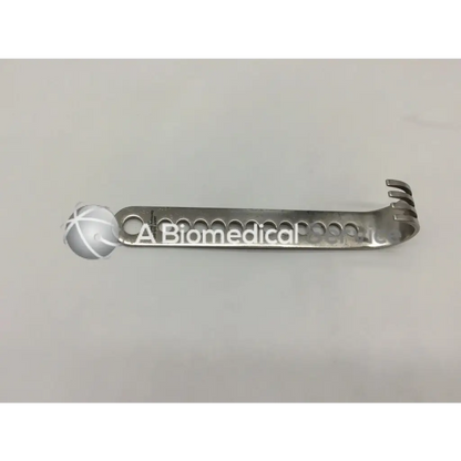 Jarit 225-503 initial incision retractor a sleek silver metallic curved handle incision retractor with notched prongs