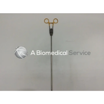 Jarit 600-261 laparoscopic in-line needle holder with gold-tipped carb-bite tips and black handle surgical forceps
