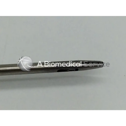 Jarit 600-261 laparoscopic in-line needle holder with silver surgical needle and white cross-hatched spherical tip carb-bite