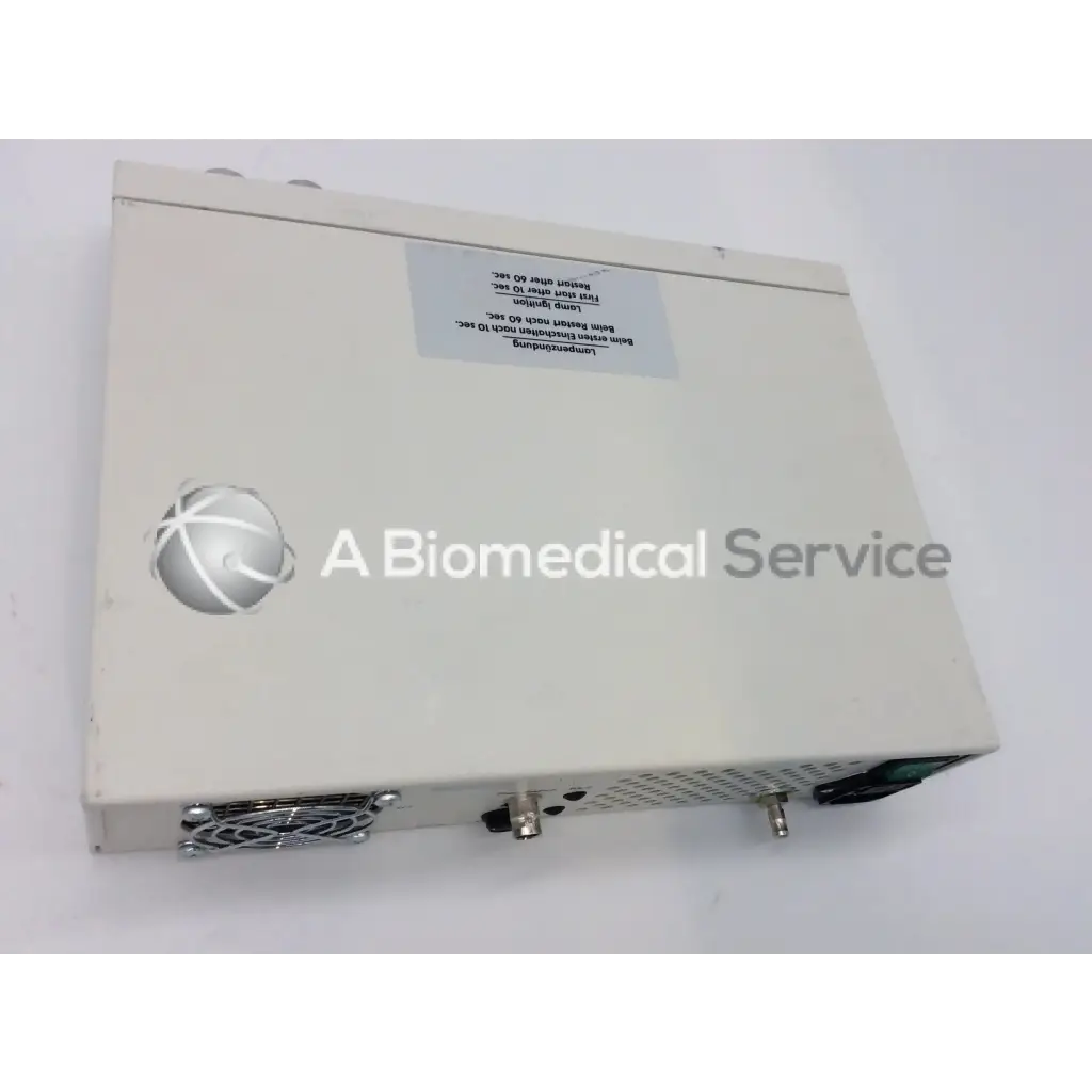 Off-white rectangular jedmed globalmed xe30 ntsc light source with silver logo and ventilation grilles on the side