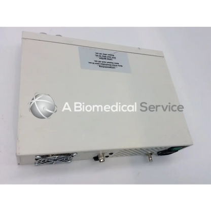 Off-white rectangular jedmed globalmed xe30 ntsc light source with silver logo and ventilation grilles on the side