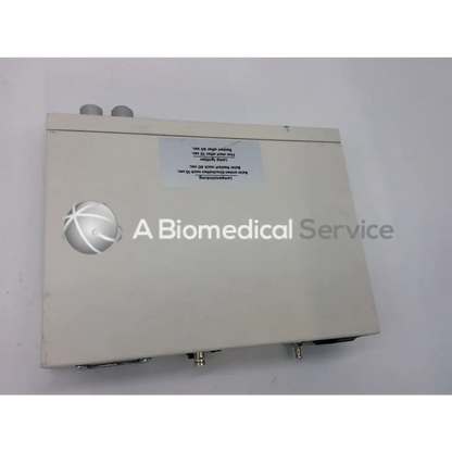 Beige rectangular jedmed globalmed xe30 ntsc light source with silver spherical logo and metallic connectors on sides