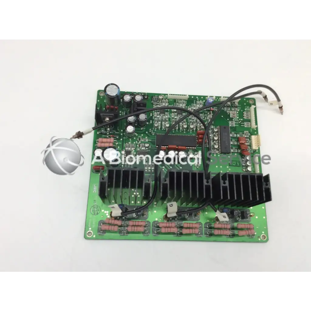 Green jrc ta-0038 pc-0662b circuit board with black heat sinks capacitors and wiring for electronic use