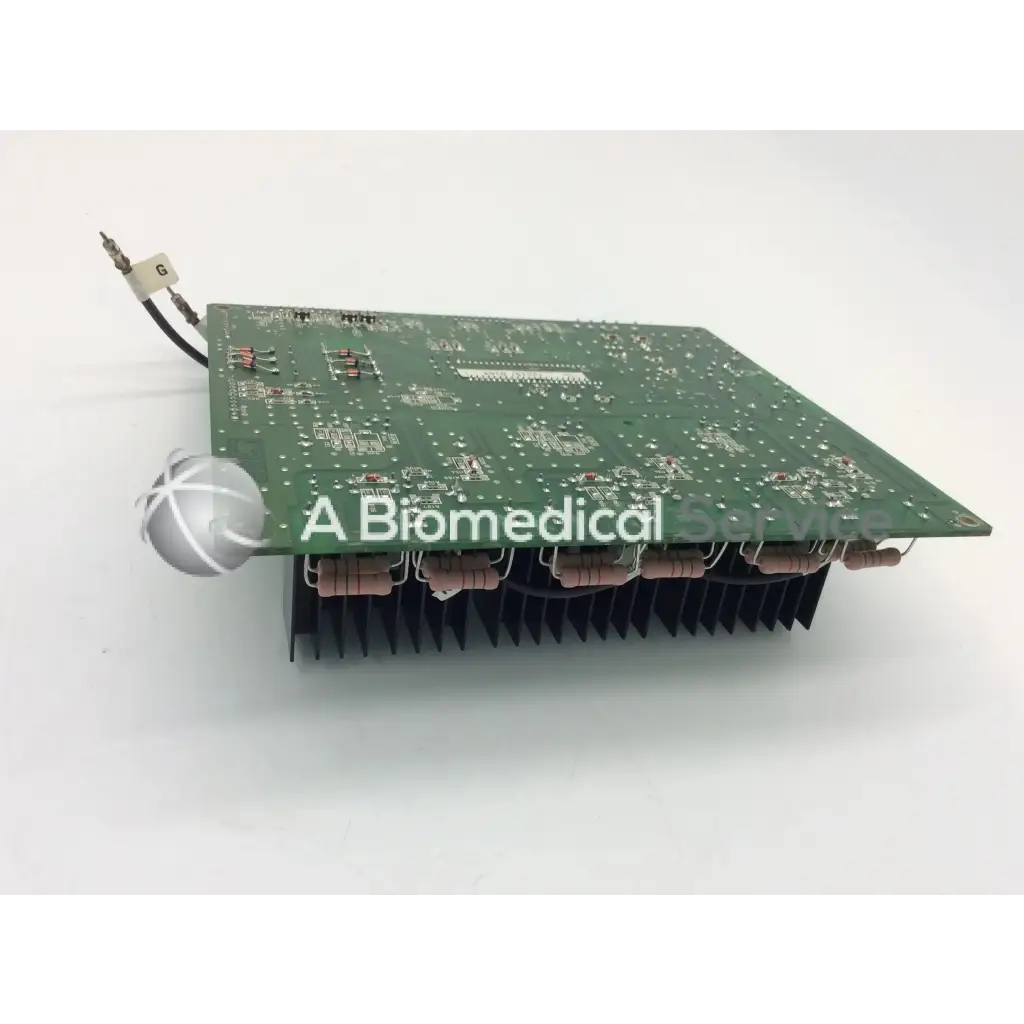 Green rectangular jrc ta-0038 pc-0662b circuit board with silver components and black heat sink fins