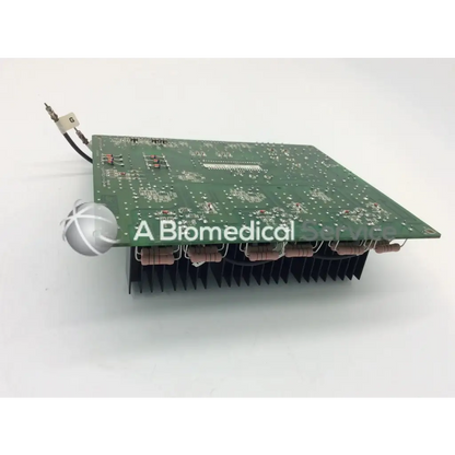 Green rectangular jrc ta-0038 pc-0662b circuit board with silver components and black heat sink fins