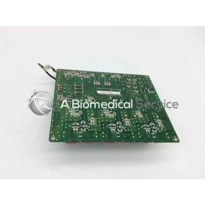 Green rectangular jrc ta-0038 pc-0662b board with silver soldered components and small white spherical object attached