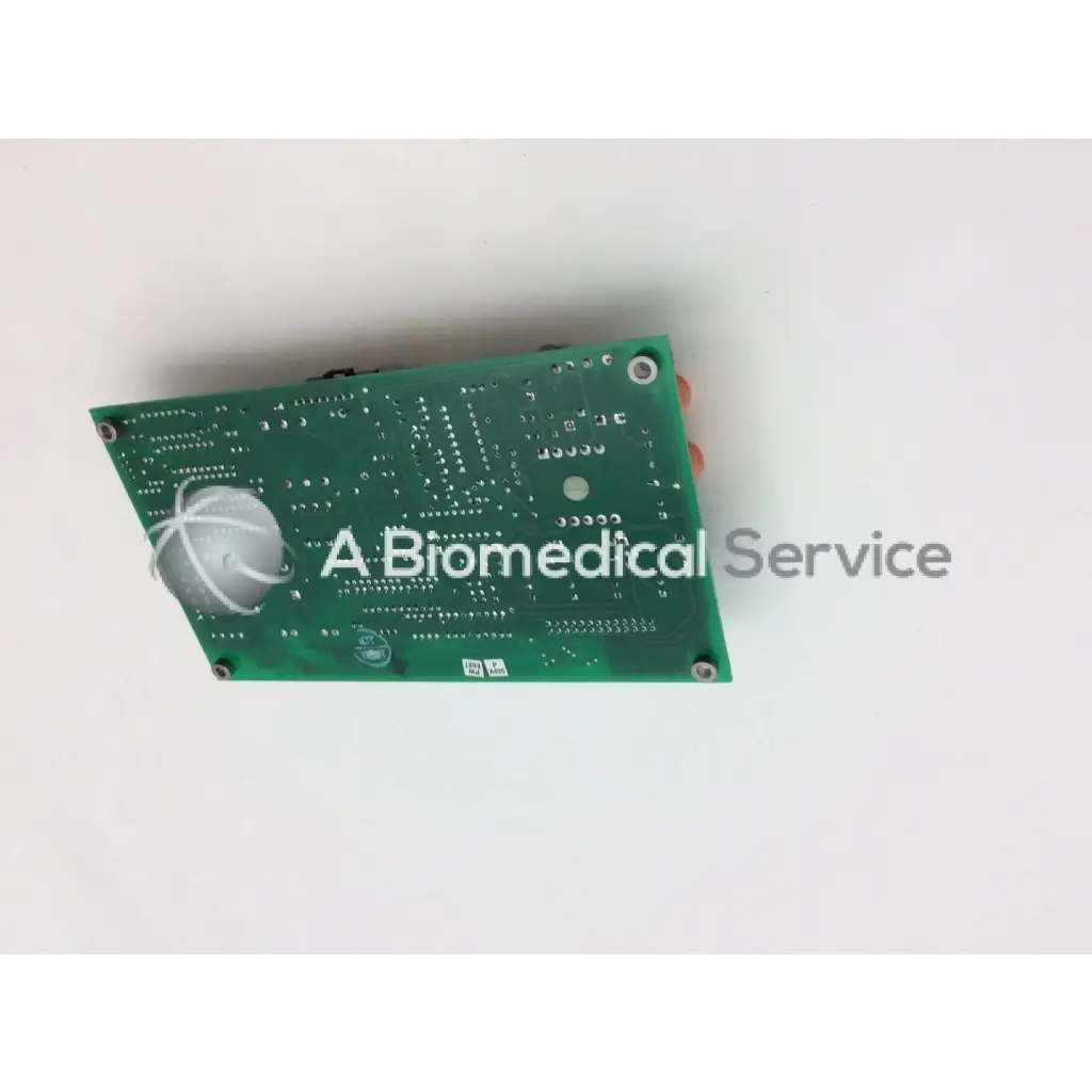 Green rectangular circuit board a125-007 with silver components and white wire on circular sensor board+a125-007 rev